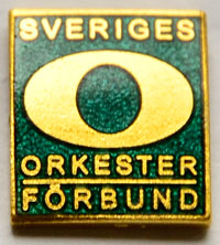 Märkesnål grön - musiker sedan fyra år